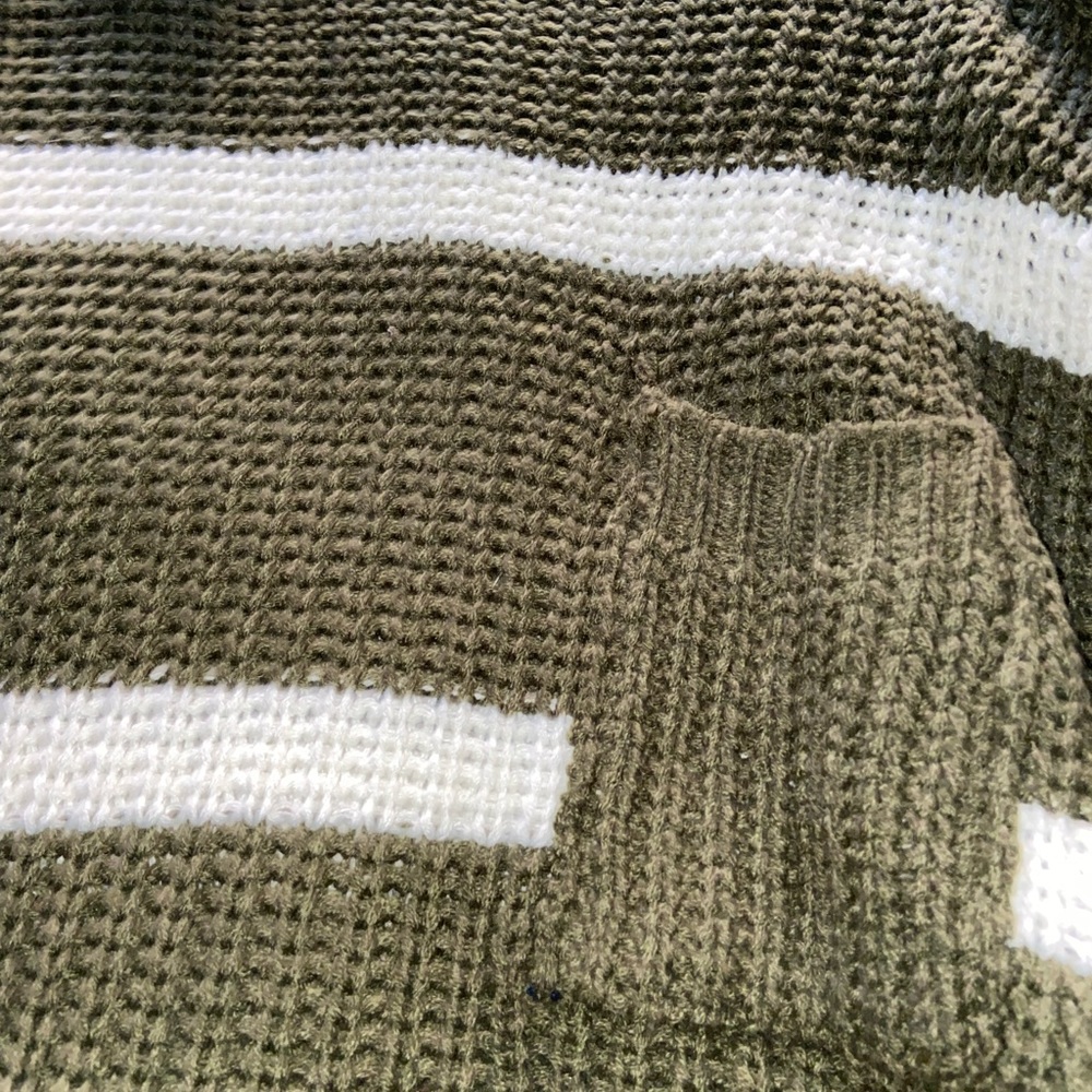 Green knitted sweater with white stripes